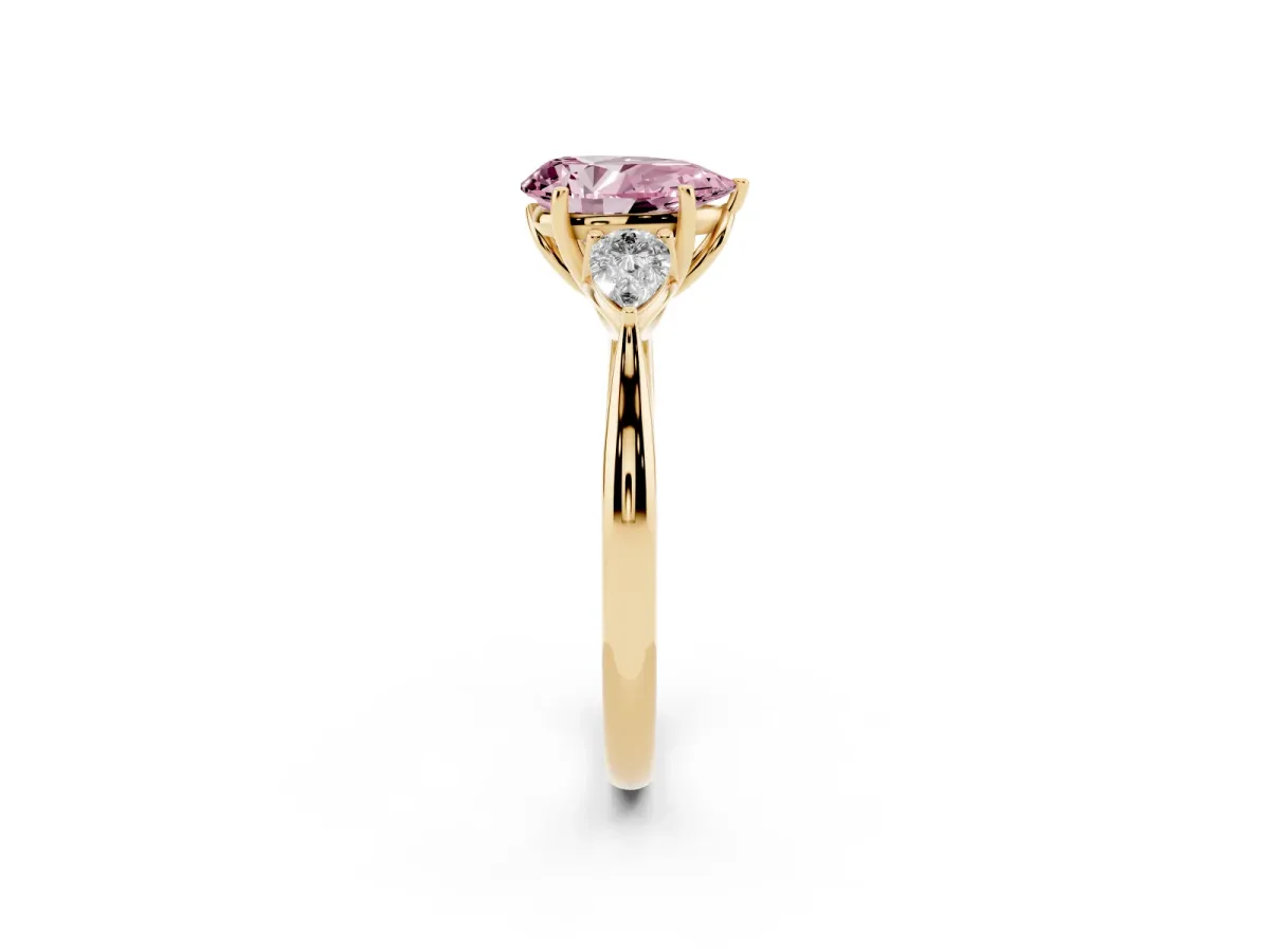 Fancy Pink Pear Cut Diamond Three-Stone Ring with Pear Side Stones and Prong Setting Yellow gold