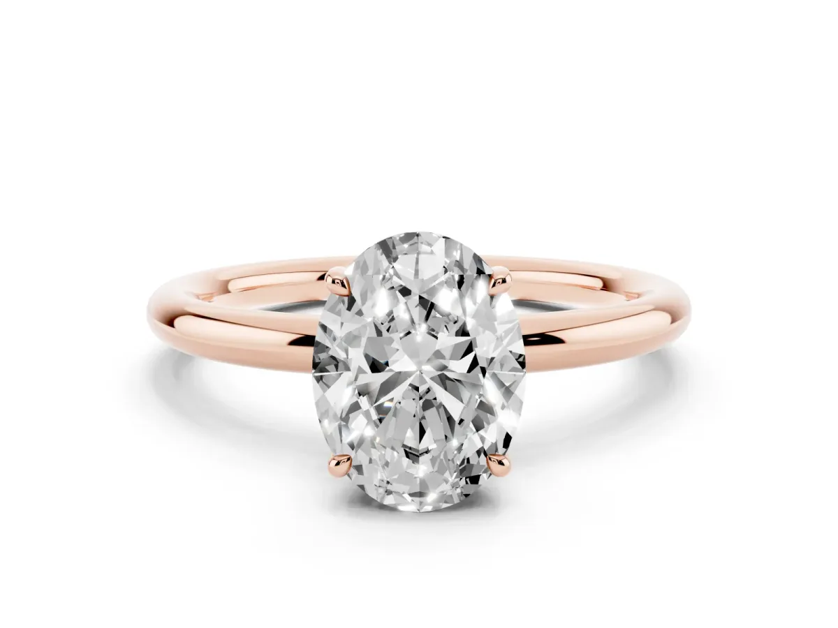 Oval Cut Diamond Solitaire Ring with Thin Band and Four-Prong Setting Rose gold