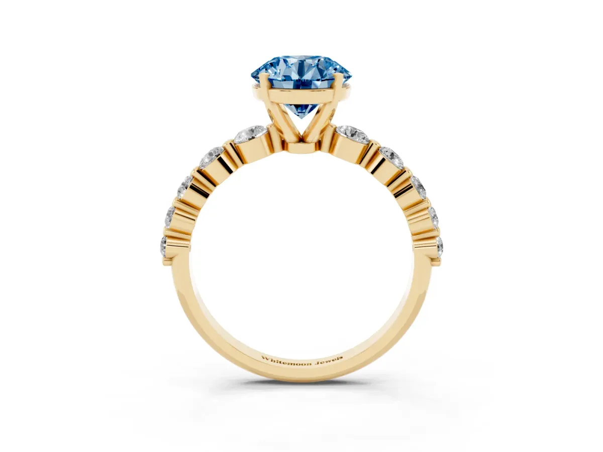 Fancy Blue Round Cut Solitaire Diamond Ring with Pave Band and Four-Prong Setting Yellow gold