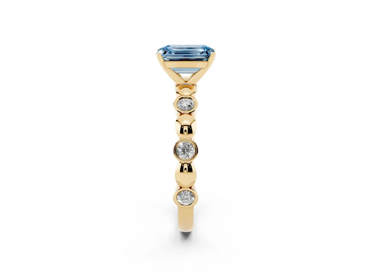 Fancy Blue Emerald Cut Solitaire Bezel-Set Diamond Ring with Beaded Band and Four-Prong Setting Yellow gold