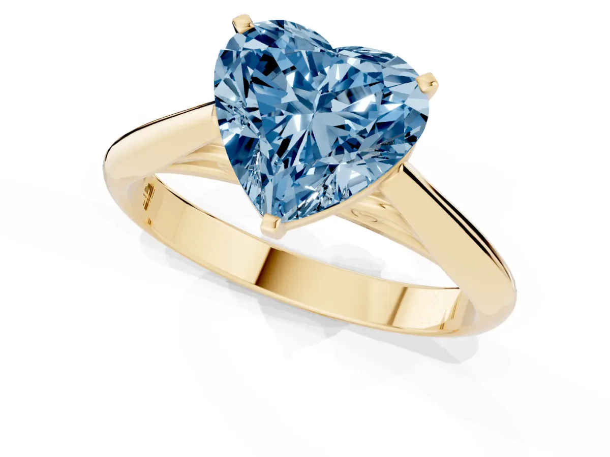 Fancy Blue Heart Cut Diamond Solitaire Engagement Ring with Cathedral Setting and Four-Prong Mount Yellow gold
