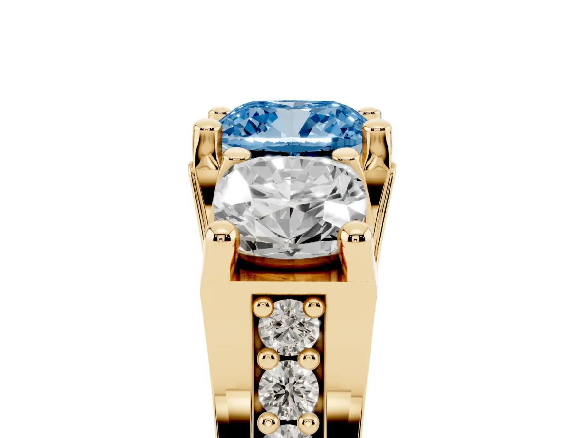 Fancy Blue Cushion Cut Diamond Three-Stone Ring with Channel Set Band and Four-Prong Setting Yellow gold