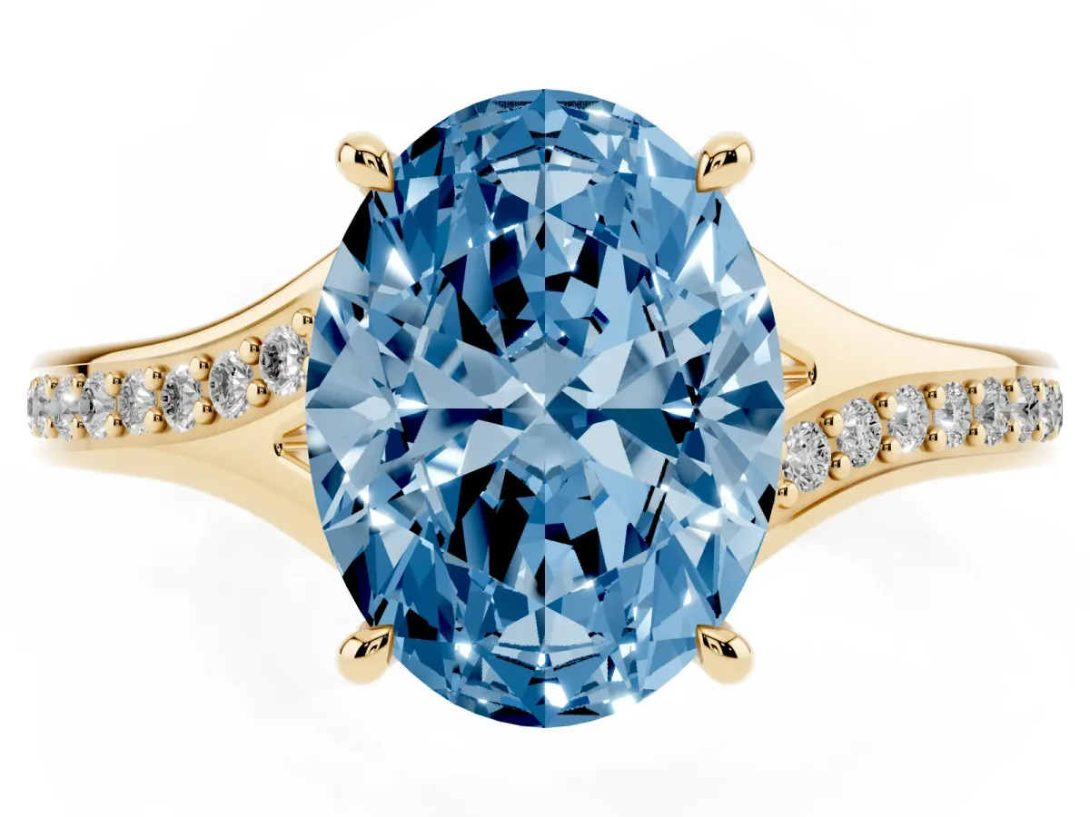 Fancy Blue Oval Cut Diamond Solitaire Ring with Pavé Band and Prong Setting Yellow gold