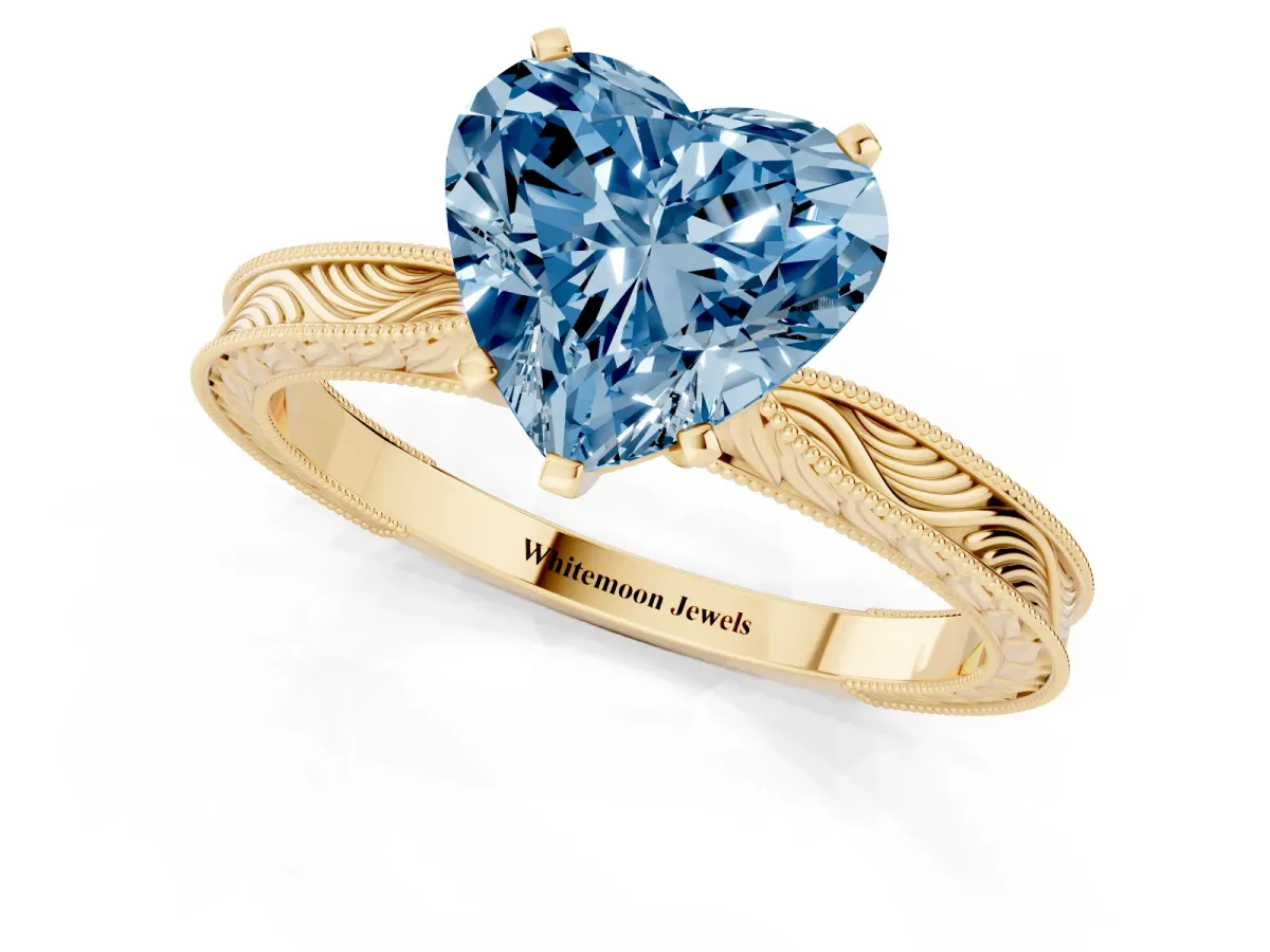 Fancy Blue Heart Cut Solitaire Milgrain Engraved Band with Four-Prong Setting Yellow gold