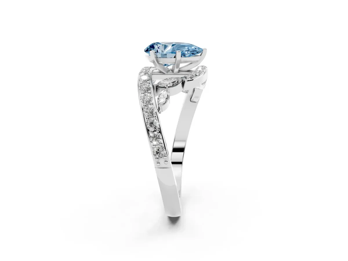 Fancy Blue Pear Cut Solitaire with Pavé Twist Band and Four-Prong Setting Silver