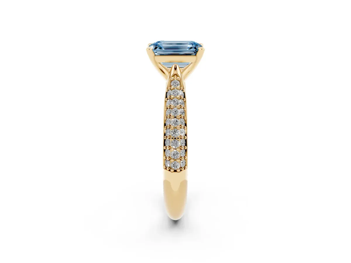 Fancy Blue Emerald Cut Diamond Solitaire Engagement Ring with Multi-Row Round Pavé Band and Prong Setting Yellow gold