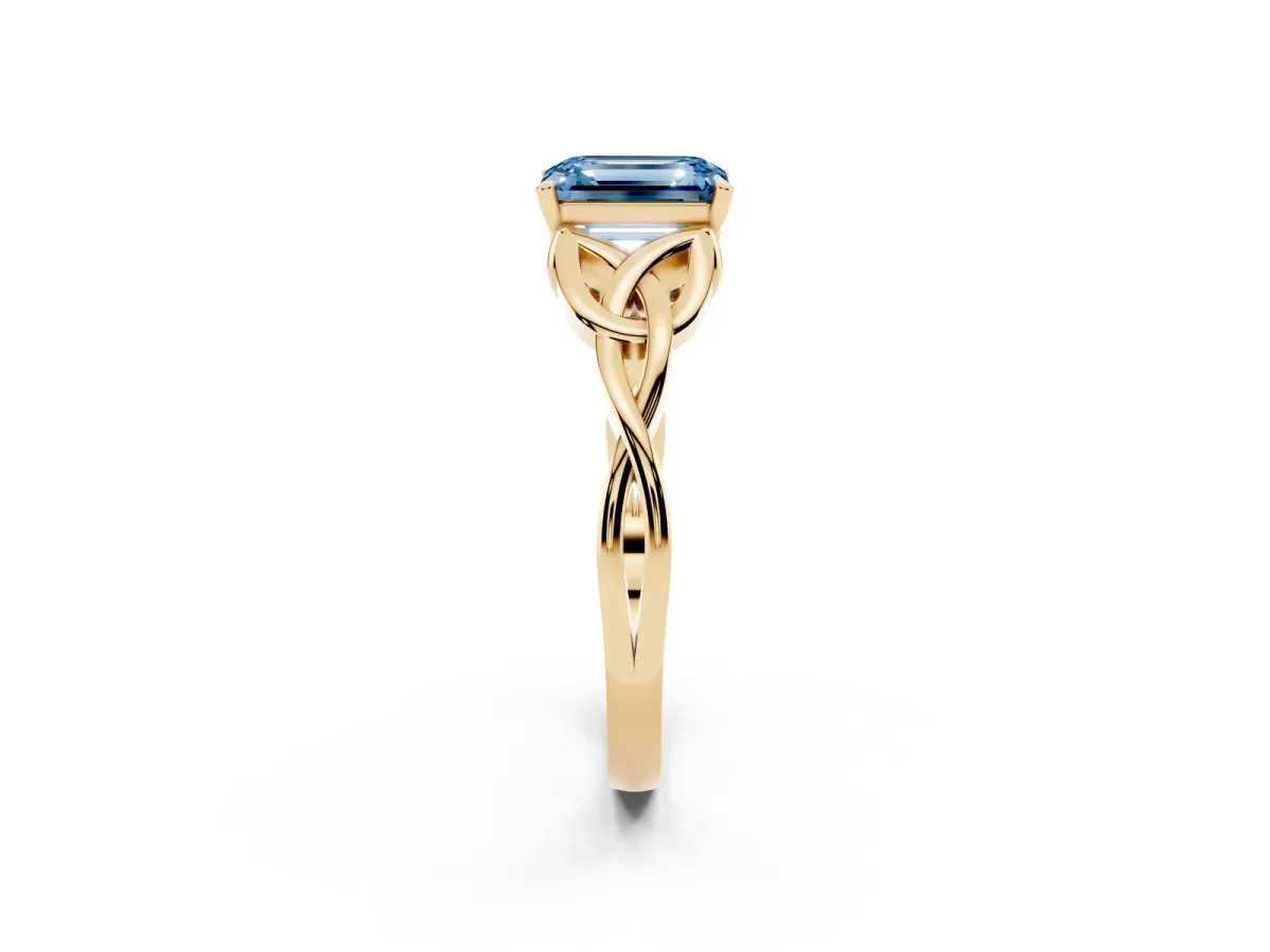 Fancy Blue Emerald Cut Diamond Solitaire Engagement Ring with Celtic Knot Band and Four-Prong Setting Yellow gold