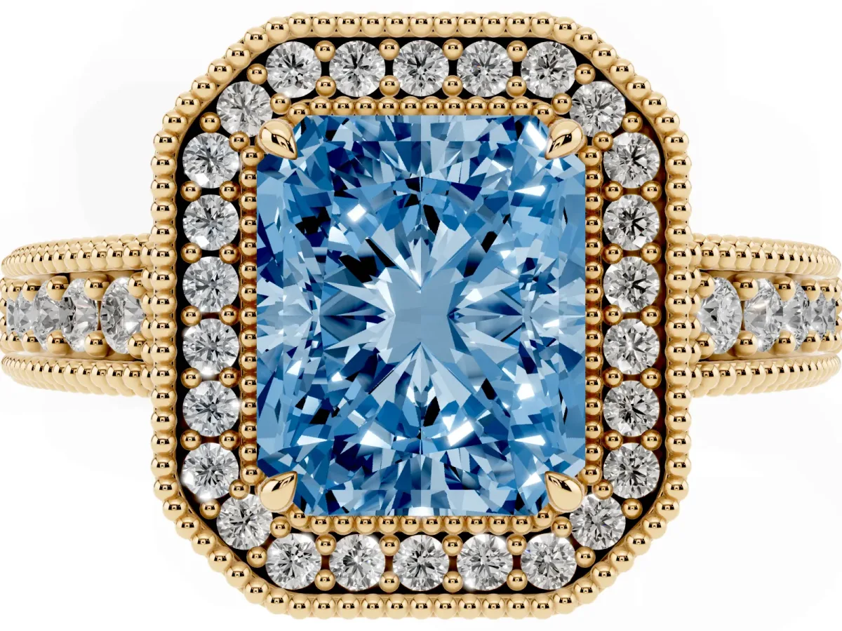 Fancy Blue Radiant Cut Cut Halo Diamond Ring with Pavé Band and Four-Prong Setting Yellow gold