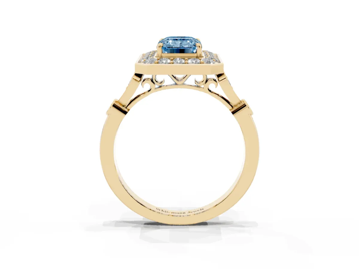 Fancy Blue Emerald Cut Halo Diamond Engagement Ring with Twisted Band and Four-Prong Setting Yellow gold