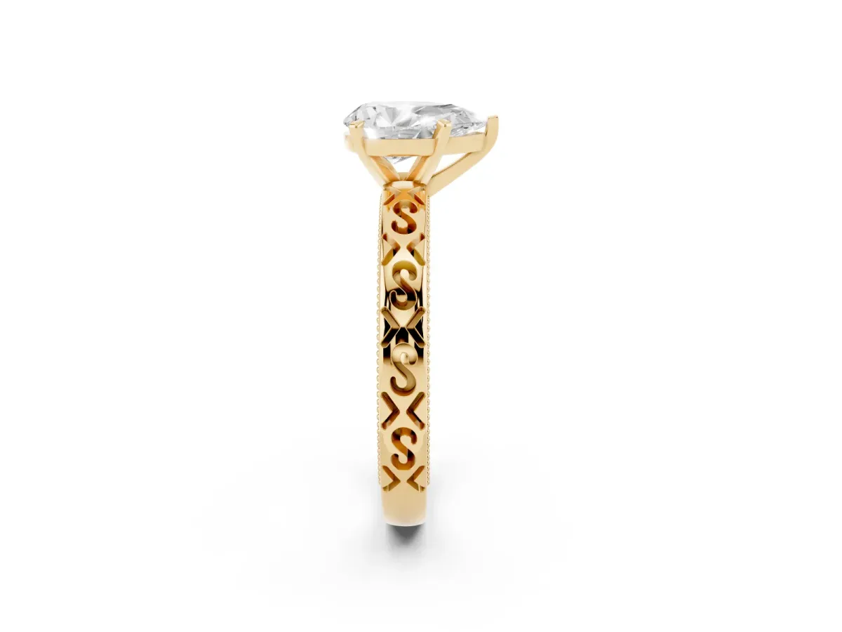 Pear Cut Solitaire Engagement Ring with Scrollwork Band and Four-Prong Setting Yellow gold