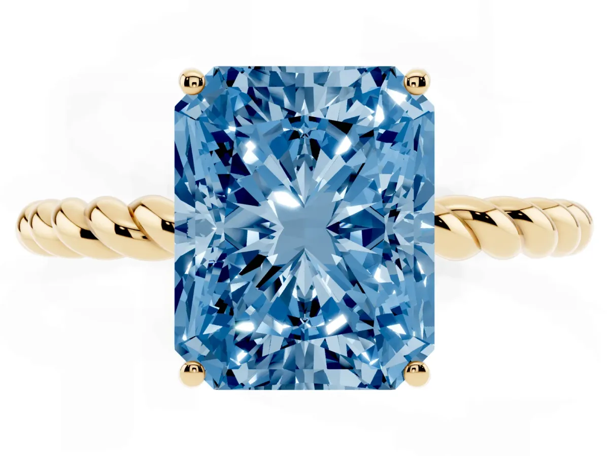 Fancy Blue Radiant Cut Solitaire Twist Band Ring with Four-Prong Setting Yellow gold