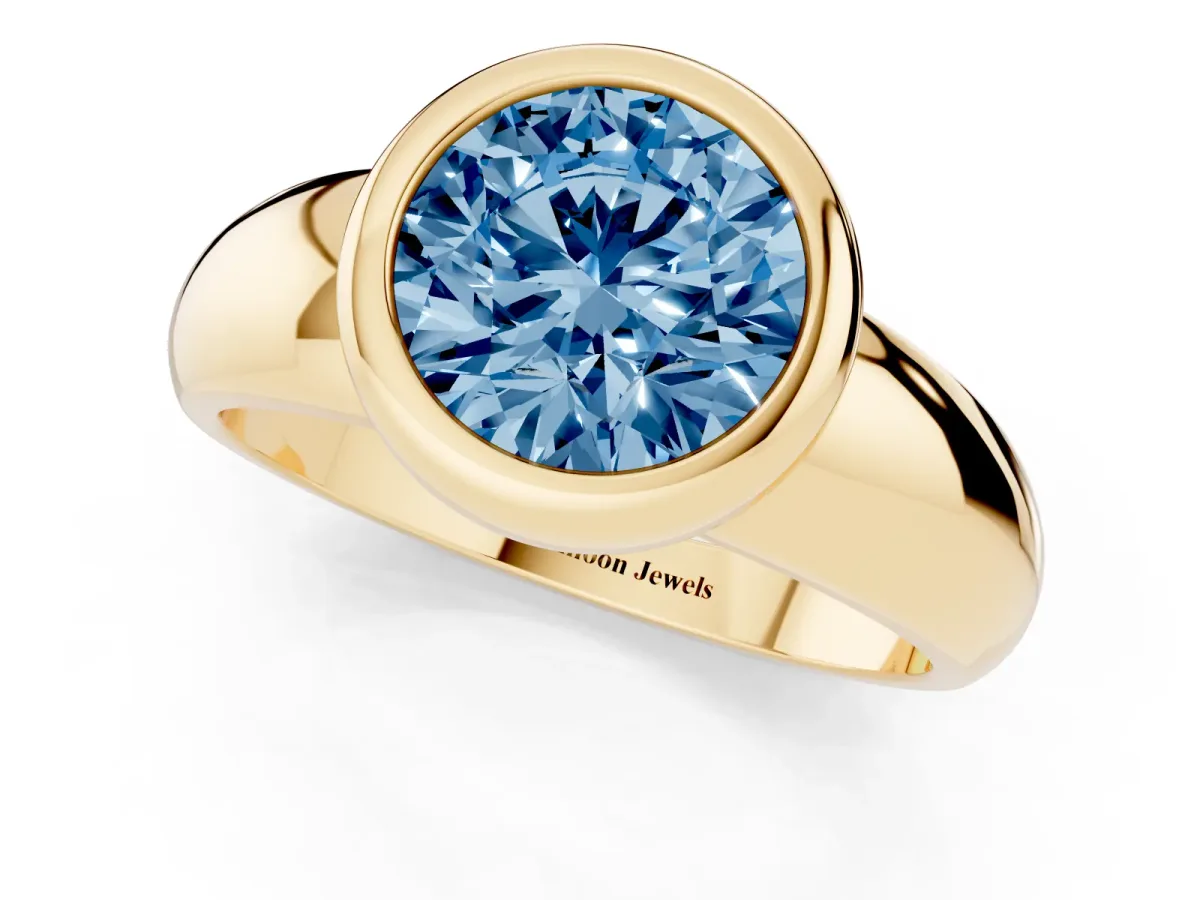 Fancy Blue Bezel Set Round Cut Solitaire Ring with Wide Band Yellow gold