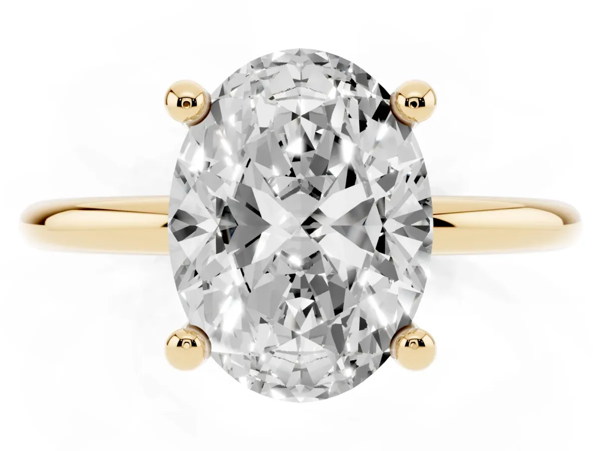 Oval Cut Solitaire Diamond Ring with 4-Prong Setting on a Classic Band Yellow gold