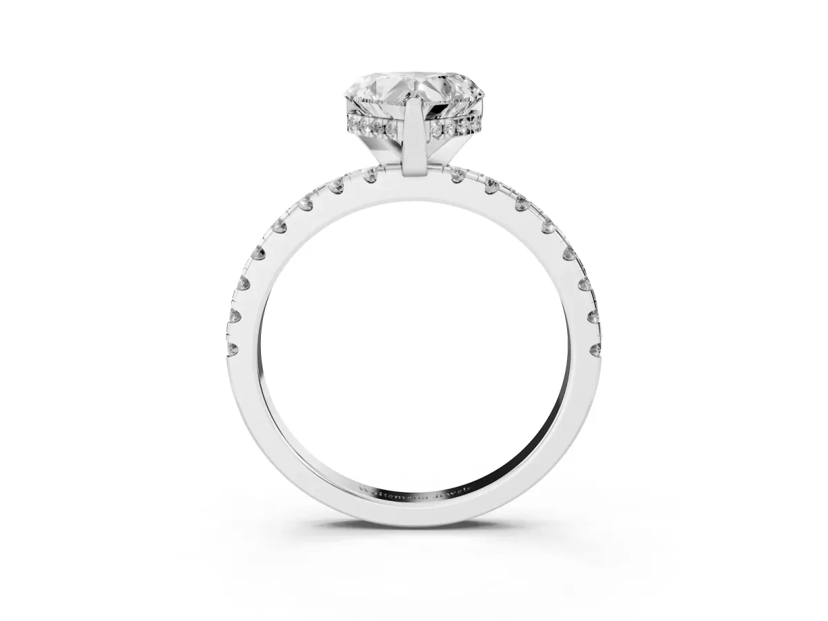 Heart Cut Diamond Solitaire Ring with Round Pavé Band and Four-Prong Setting Silver