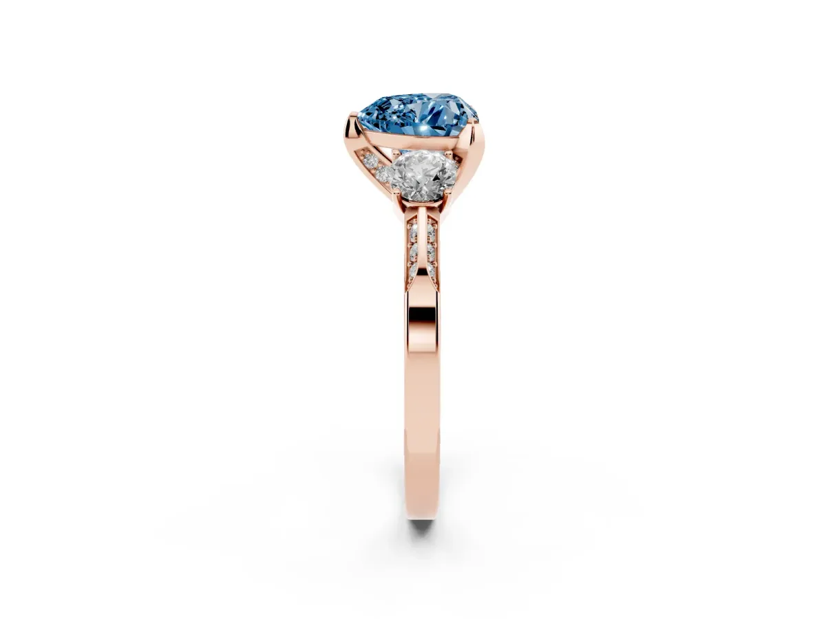 Fancy Blue Heart Cut Brilliant Three-Stone Diamond Ring with Pavé Band and Four-Prong Setting Rose gold