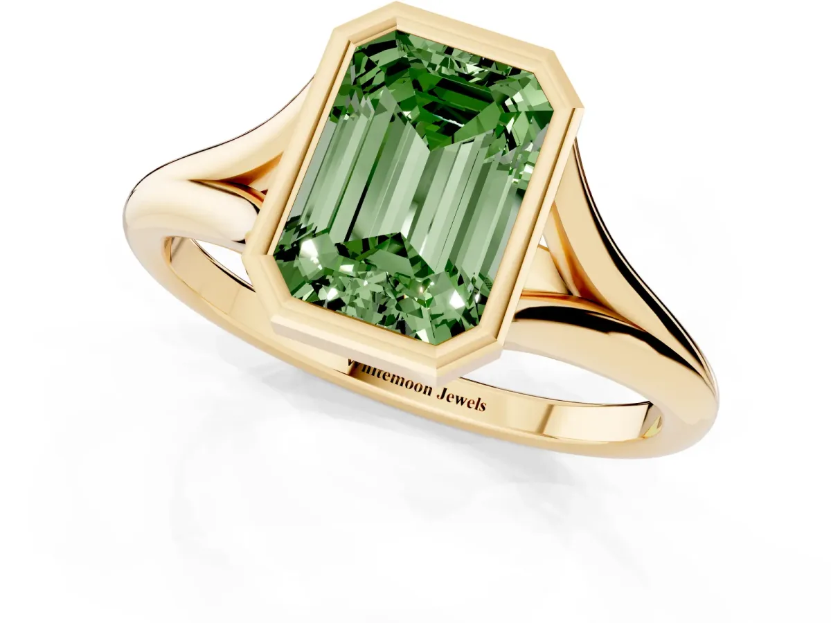 Fancy Green Bezel Set Emerald Cut Cut Solitaire Ring with Tapered Band Yellow gold