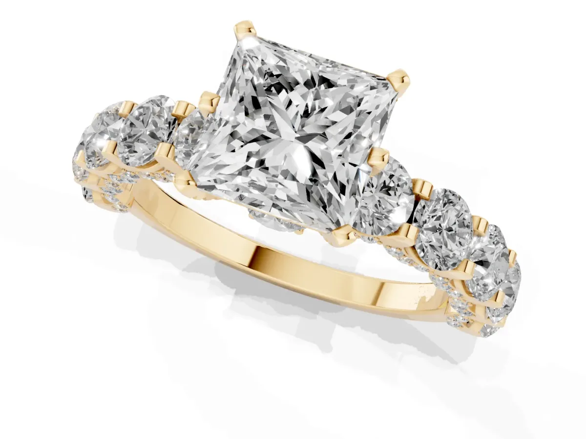 Princess Cut Diamond Side Stone Engagement Ring with Four-Prong Setting Yellow gold
