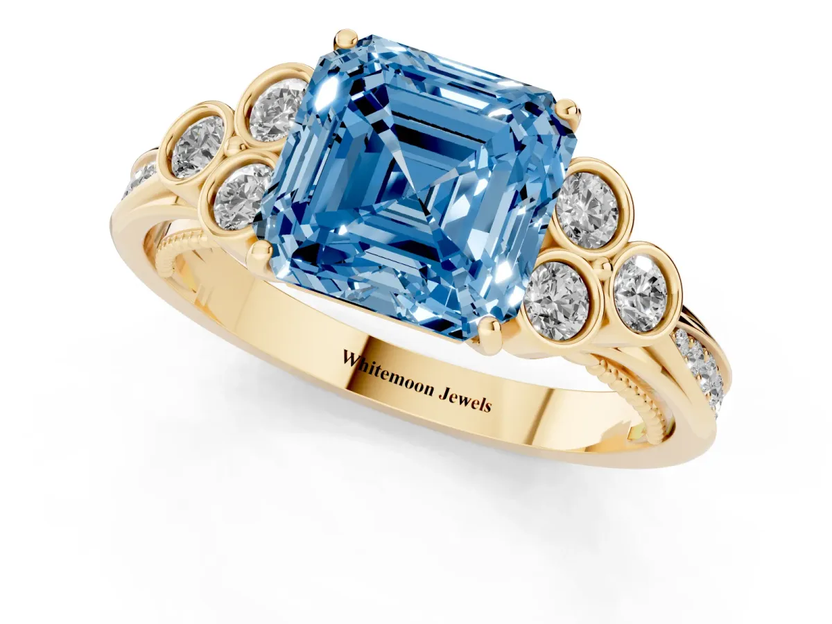 Fancy Blue Asscher Cut Cut Diamond Engagement Ring with Bezel Set Round Side Stones and Prong Setting Yellow gold