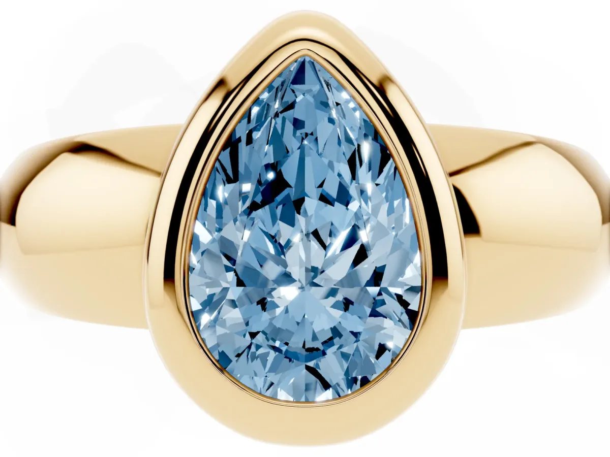 Fancy Blue Bezel Set Pear Cut Solitaire Ring with Wide Band Yellow gold