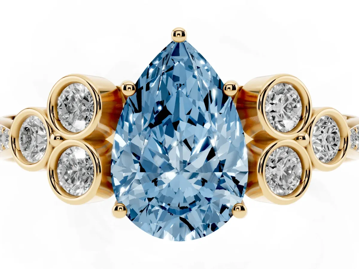 Fancy Blue Pear Cut Cut Diamond Engagement Ring with Bezel Set Round Side Stones and Prong Setting Yellow gold