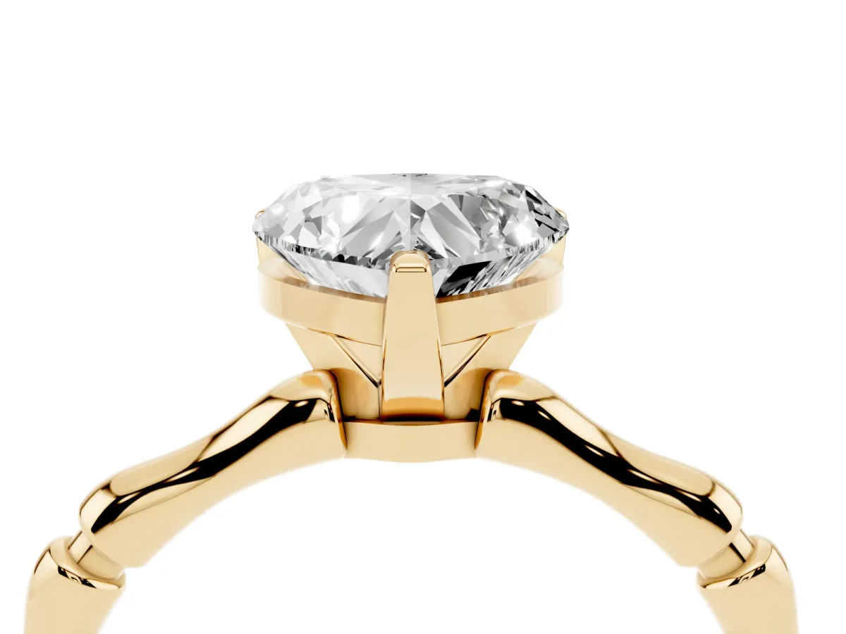 Heart Cut Solitaire Diamond Ring with Bamboo Band and Four-Prong Setting Yellow gold