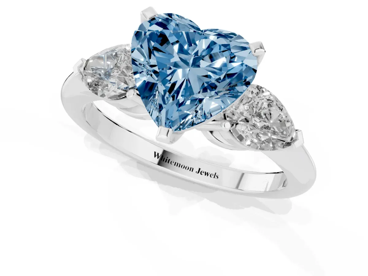 Fancy Blue Three-Stone Heart Cut Diamond Ring with Pear Side Stones and Four-Prong Setting Silver