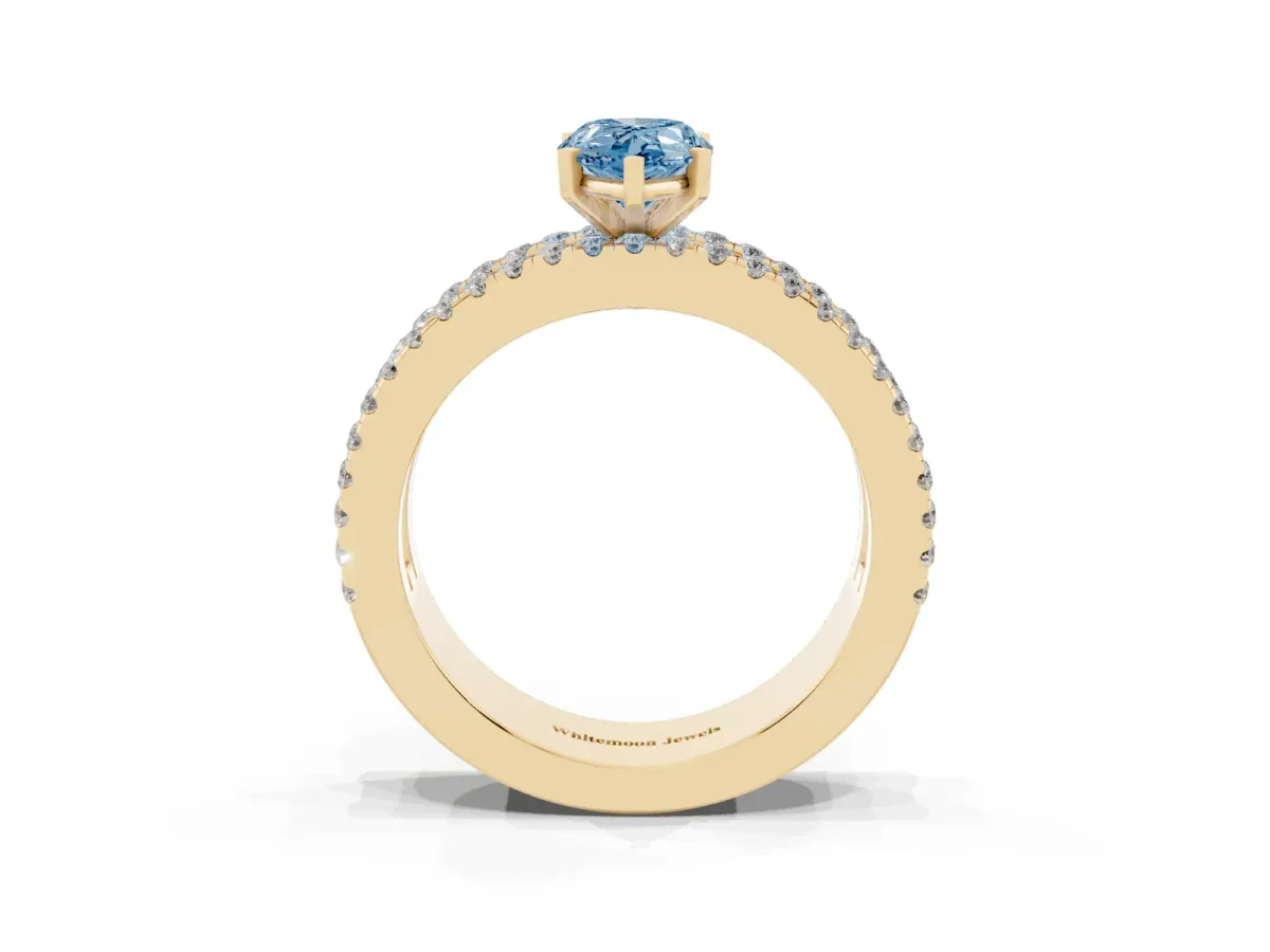 Fancy Blue Pear Cut Diamond Solitaire Ring with Pavé and Channel Set Band Yellow gold