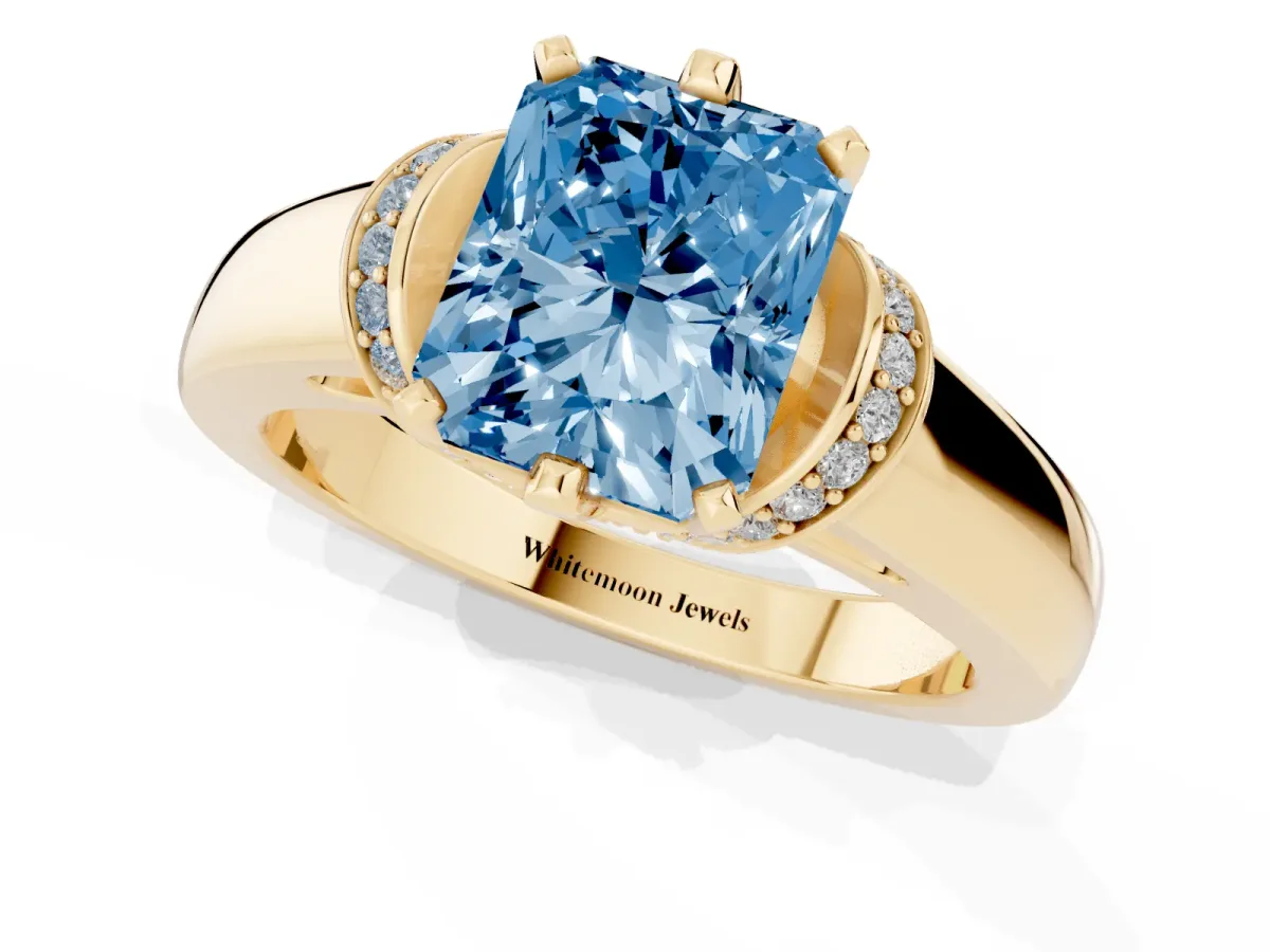 Fancy Blue Radiant Cut Solitaire Diamond Ring with Pave Band and Six-Prong Setting Yellow gold