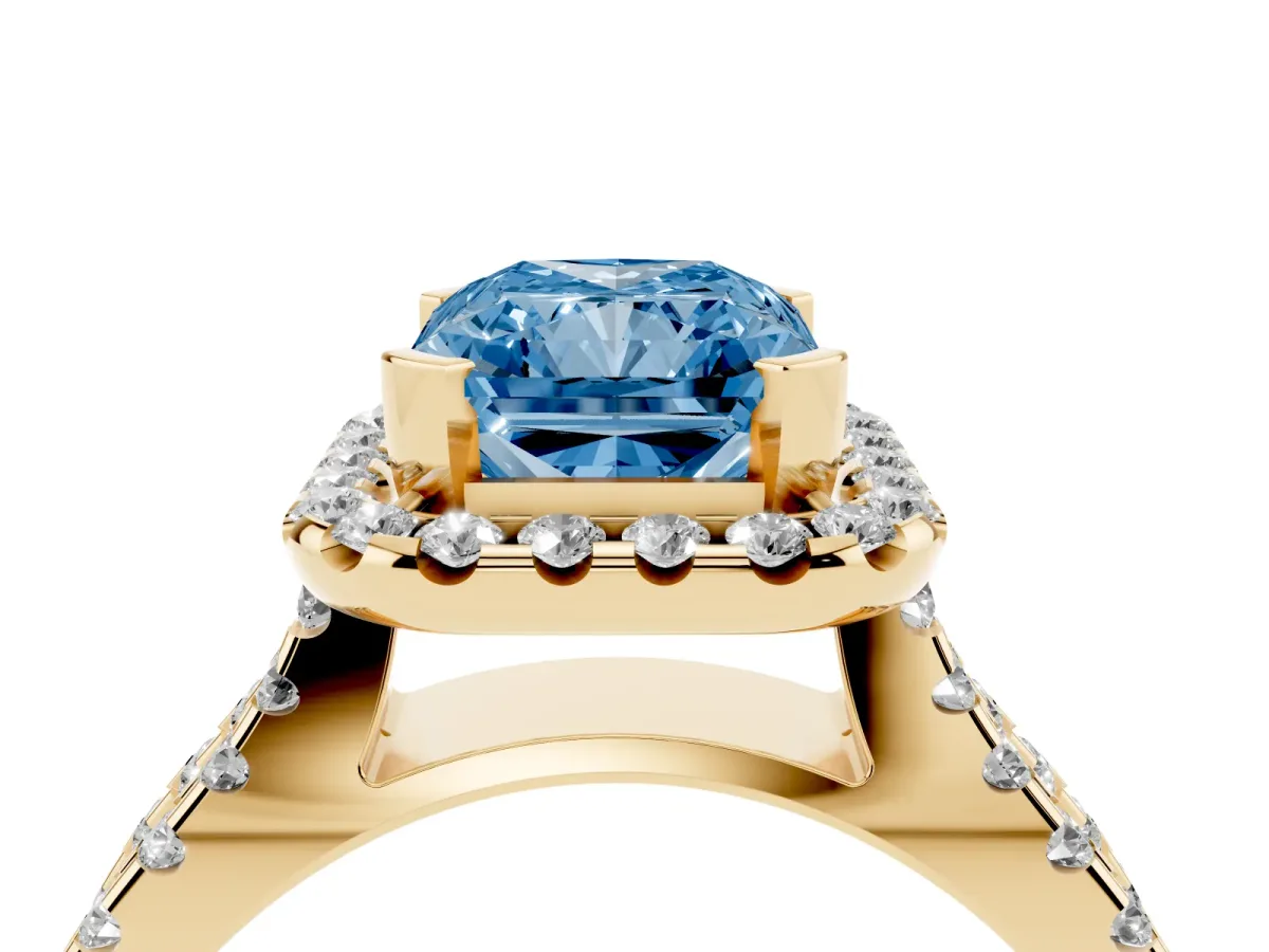 Fancy Blue Radiant Cut Diamond Halo Ring with Split Shank Pavé Band and Prong Setting Yellow gold
