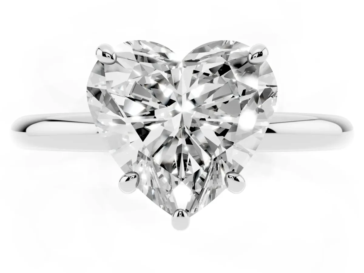 Heart Cut Solitaire Diamond Ring with Four-Prong Setting on a Plain Band Platinum