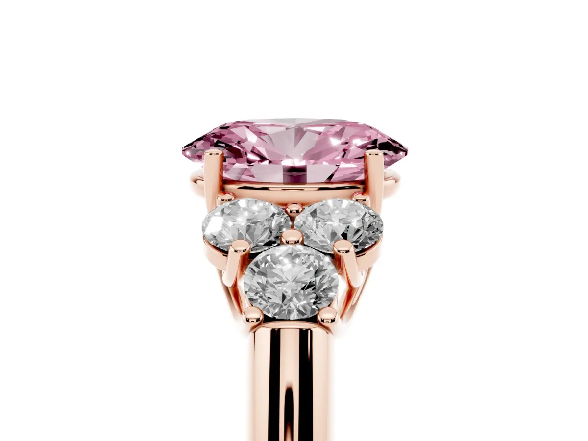 Fancy Pink Oval Cut Cut Diamond Cluster Ring with Round Accent Stones and Prong Setting on a Classic Band Rose gold