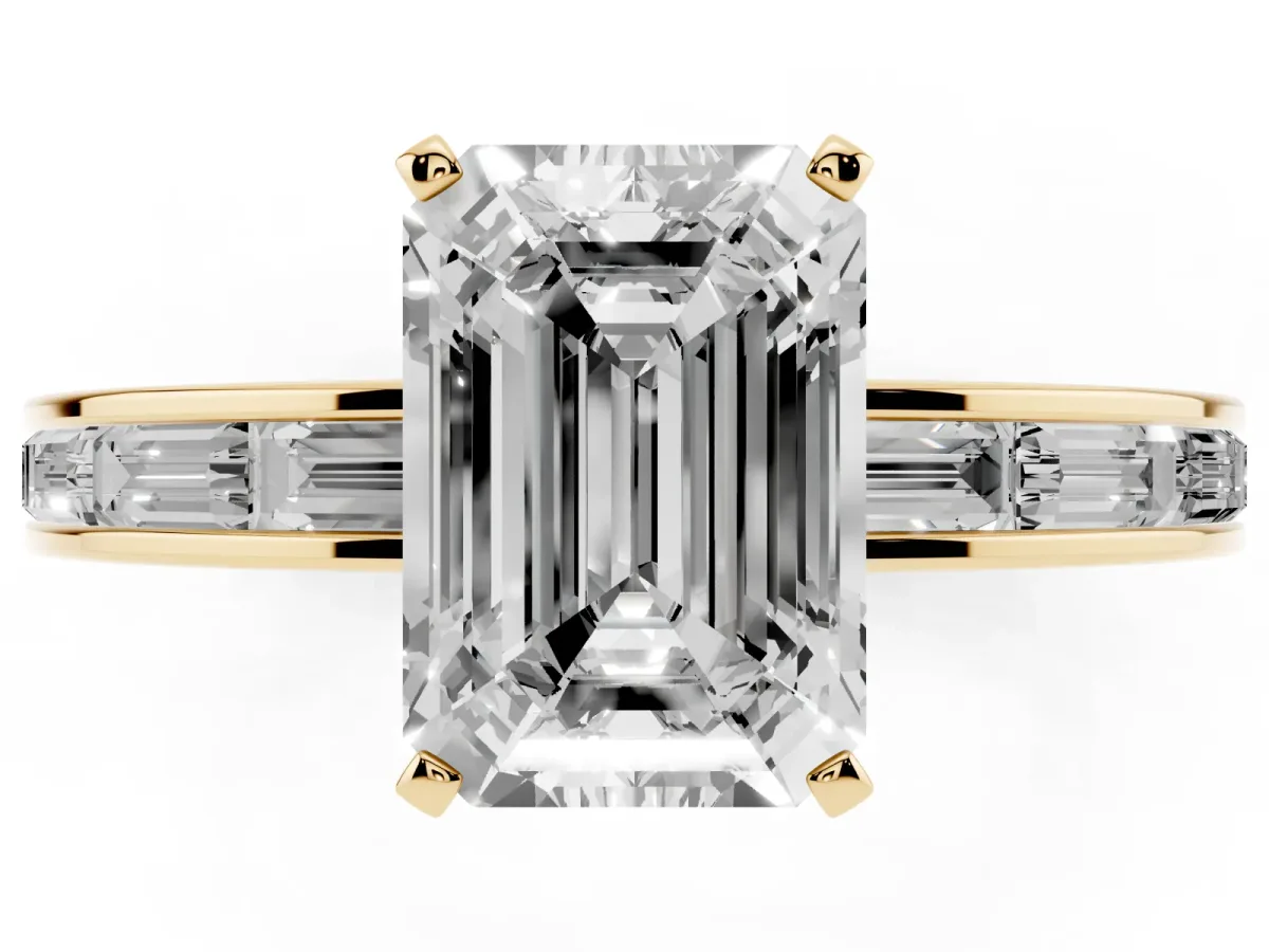 Emerald Cut Solitaire Diamond Ring with Channel-Set Baguette Band and Four-Prong Setting Yellow gold