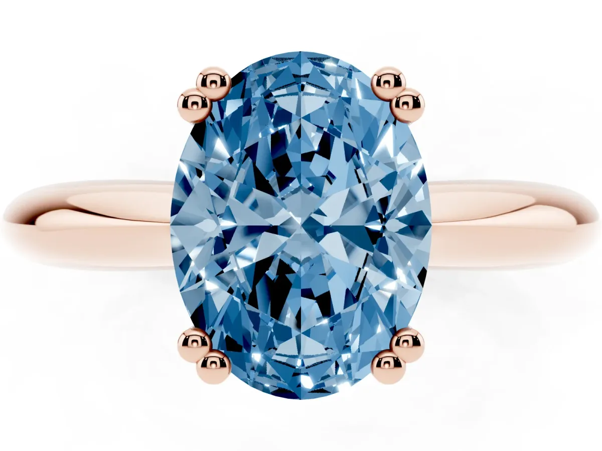 Fancy Blue Oval Cut Cut Solitaire Engagement Ring with Tapered Band and Four-Prong Setting Rose gold