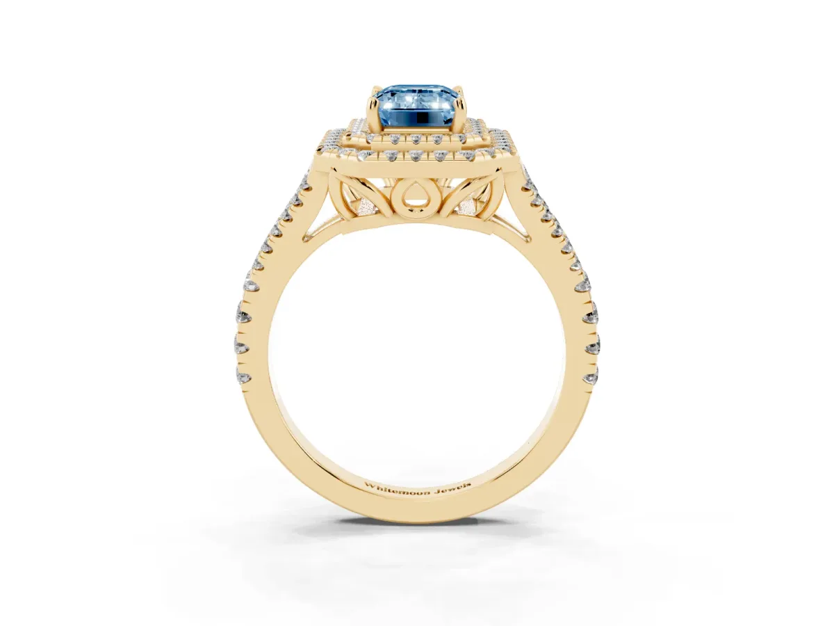 Fancy Blue Emerald Cut Diamond Double Halo Ring with Pavé Band and Prong Setting Yellow gold