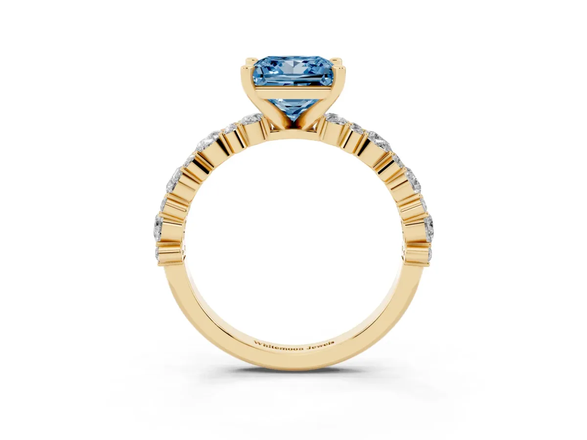 Fancy Blue Princess Cut Diamond Side Stone Solitaire Ring with Round and Four-Prong Setting Yellow gold
