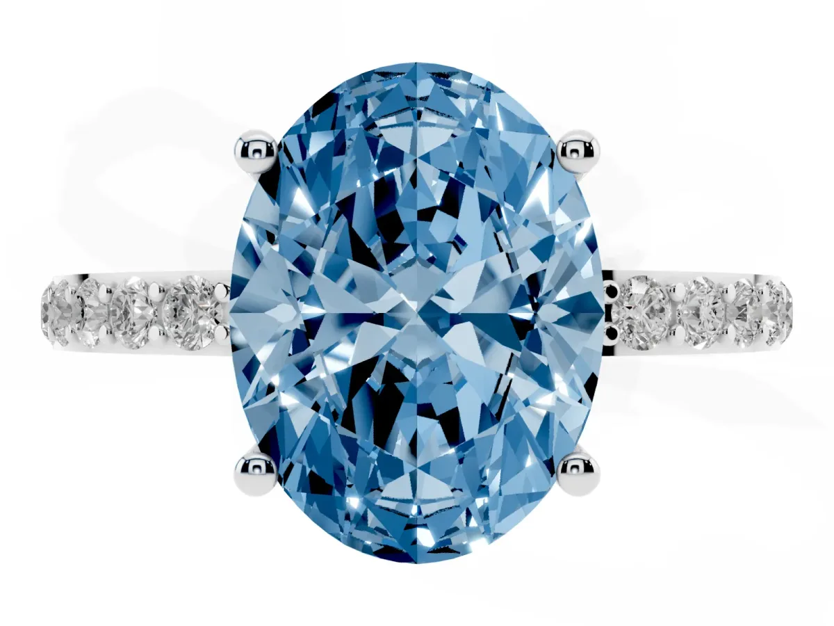 Fancy Blue Oval Cut Diamond Solitaire Ring with Round Pavé Shoulders and Prong Setting Silver