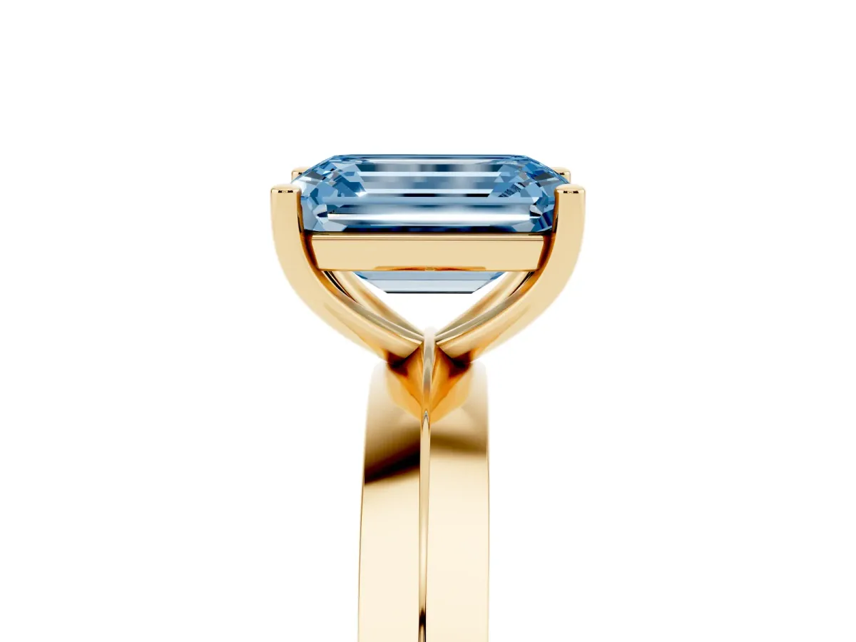 Fancy Blue Emerald Cut Cut Solitaire Engagement Ring with Flat Band and Four-Prong Setting Yellow gold