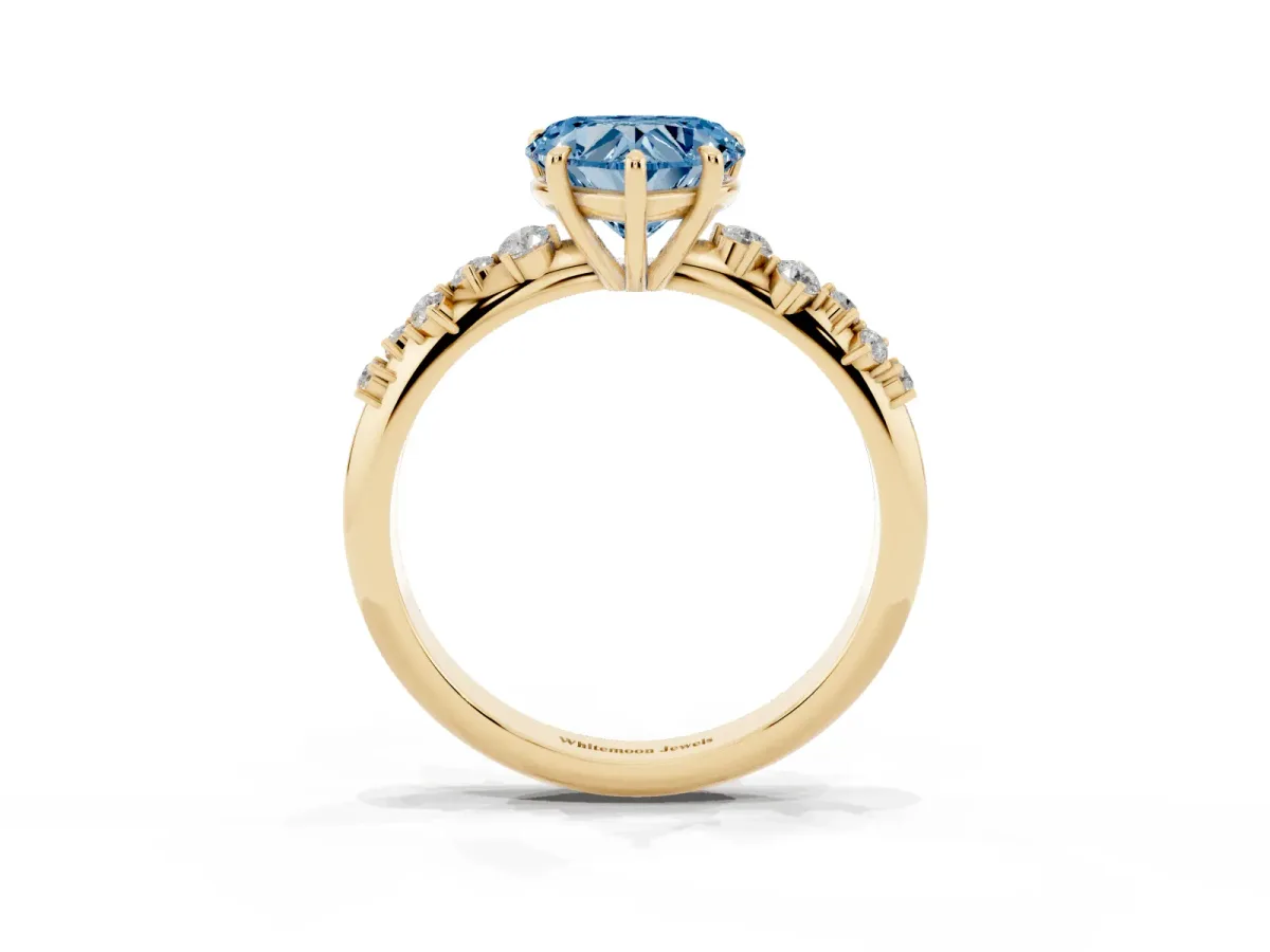 Fancy Blue Heart Cut Diamond Cluster Side Stone Solitaire Ring with Prong Setting Yellow gold