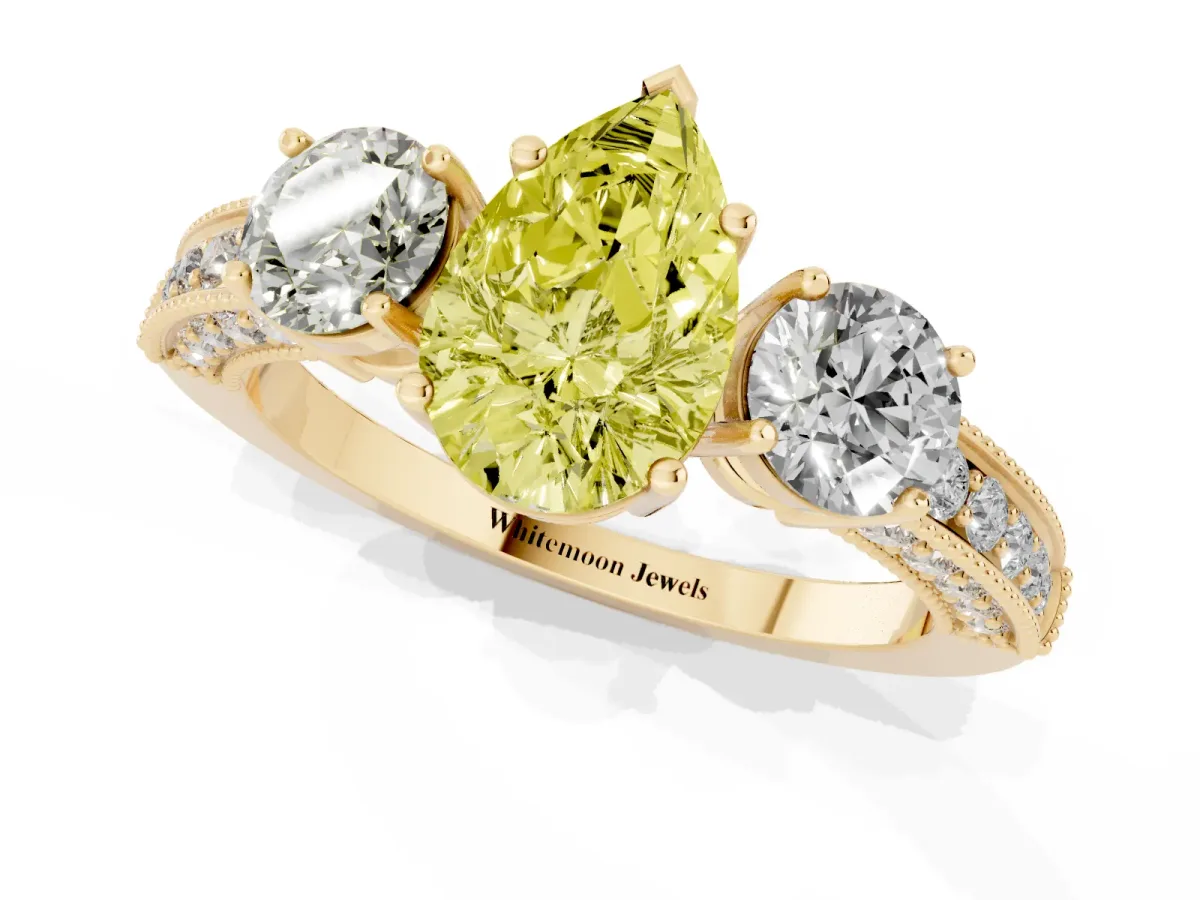 Fancy Yellow Pear Cut Three-Stone Diamond Ring with Pavé Band and Four-Prong Setting Yellow gold