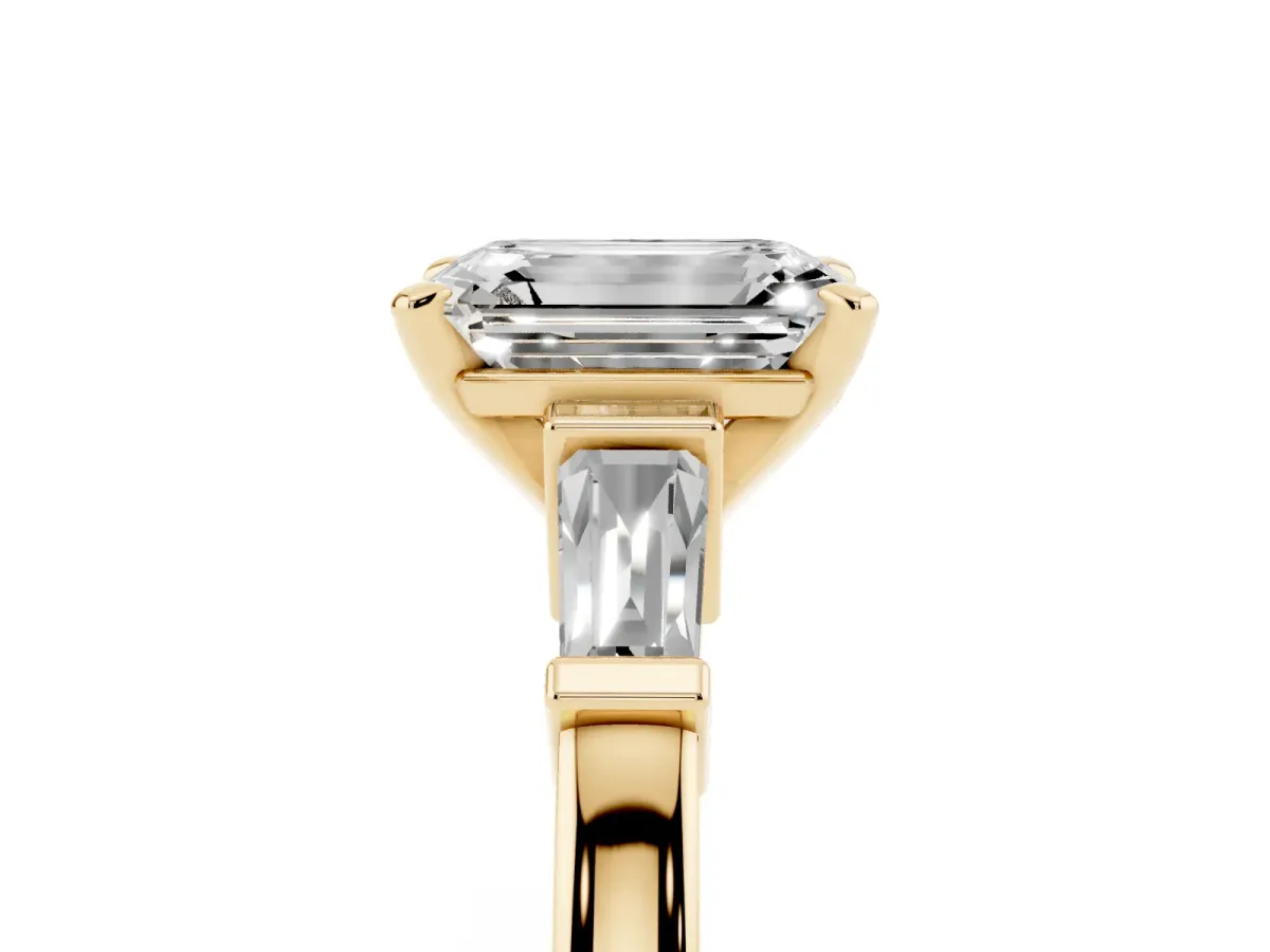 Emerald Cut Cut Diamond Solitaire Ring with Tapered Baguette Accents and Four-Prong Setting Yellow gold