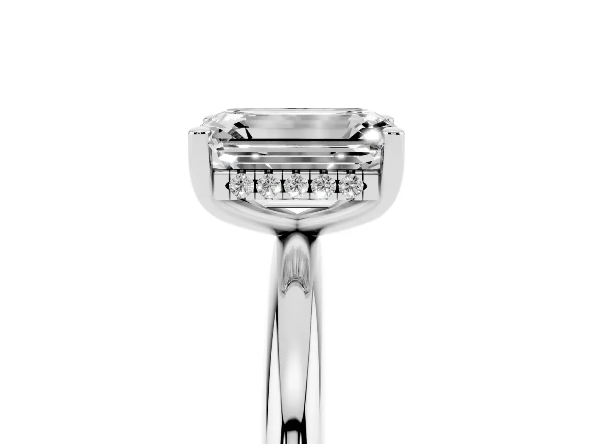 Emerald Cut Cut Solitaire Engagement Ring with Four-Prong Setting and Classic Band Silver