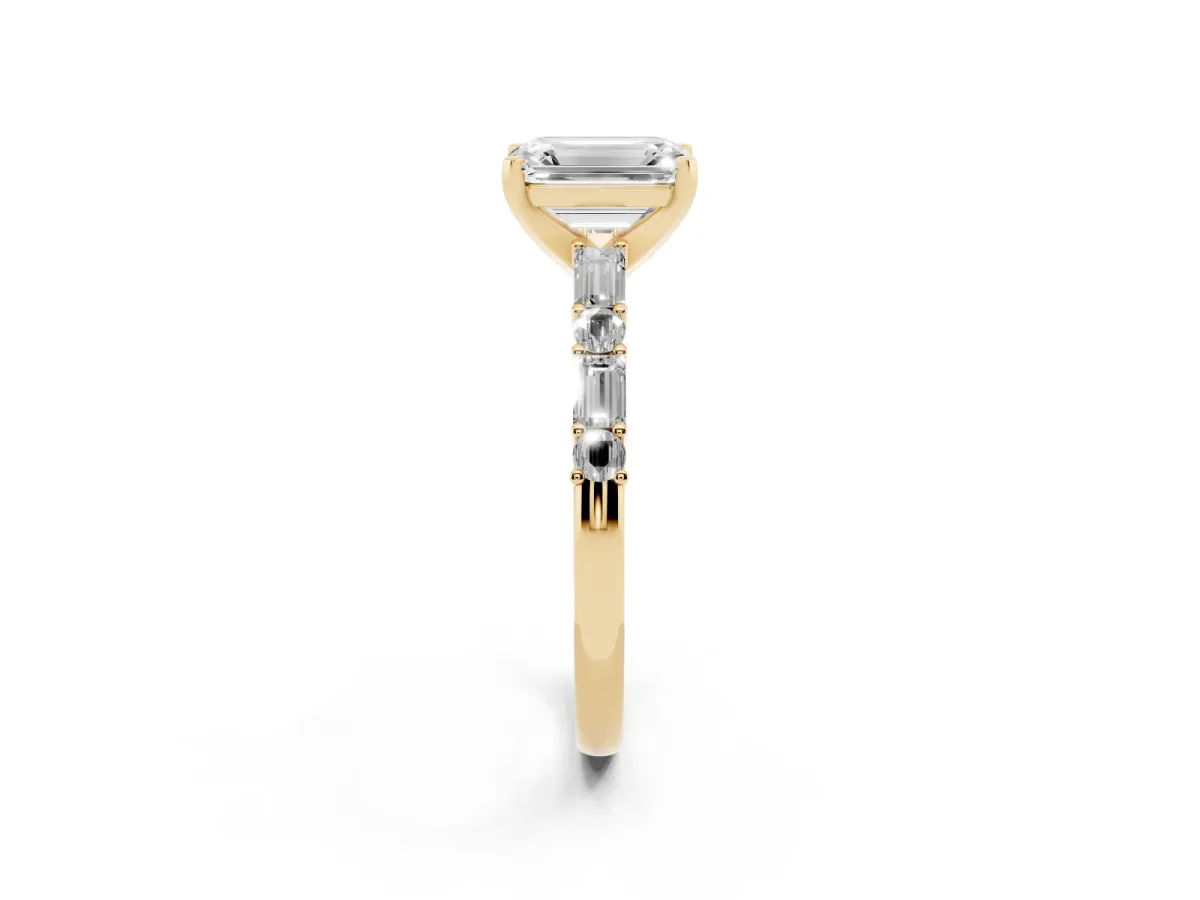 Emerald Cut Diamond Solitaire with Side Baguettes and Channel Set Band Yellow gold