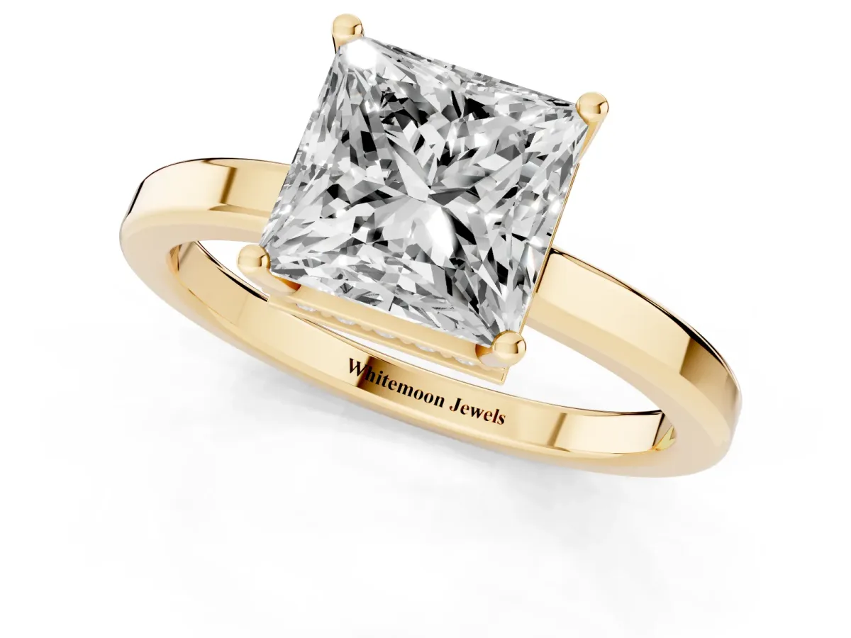 Princess Cut Cut Solitaire Engagement Ring with Four-Prong Setting on a Classic Band Yellow gold
