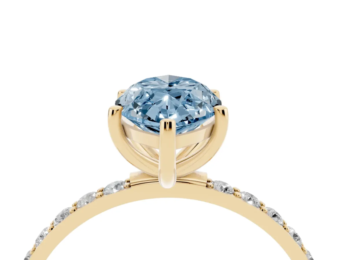 Fancy Blue Marquise Cut Diamond Solitaire Ring with Round Pavé Shoulders and Prong Setting Yellow gold
