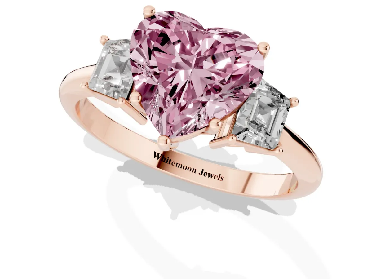 Fancy Pink Heart Cut Diamond Three-Stone Ring with Trapezoid Side Stones and Prong Setting Rose gold