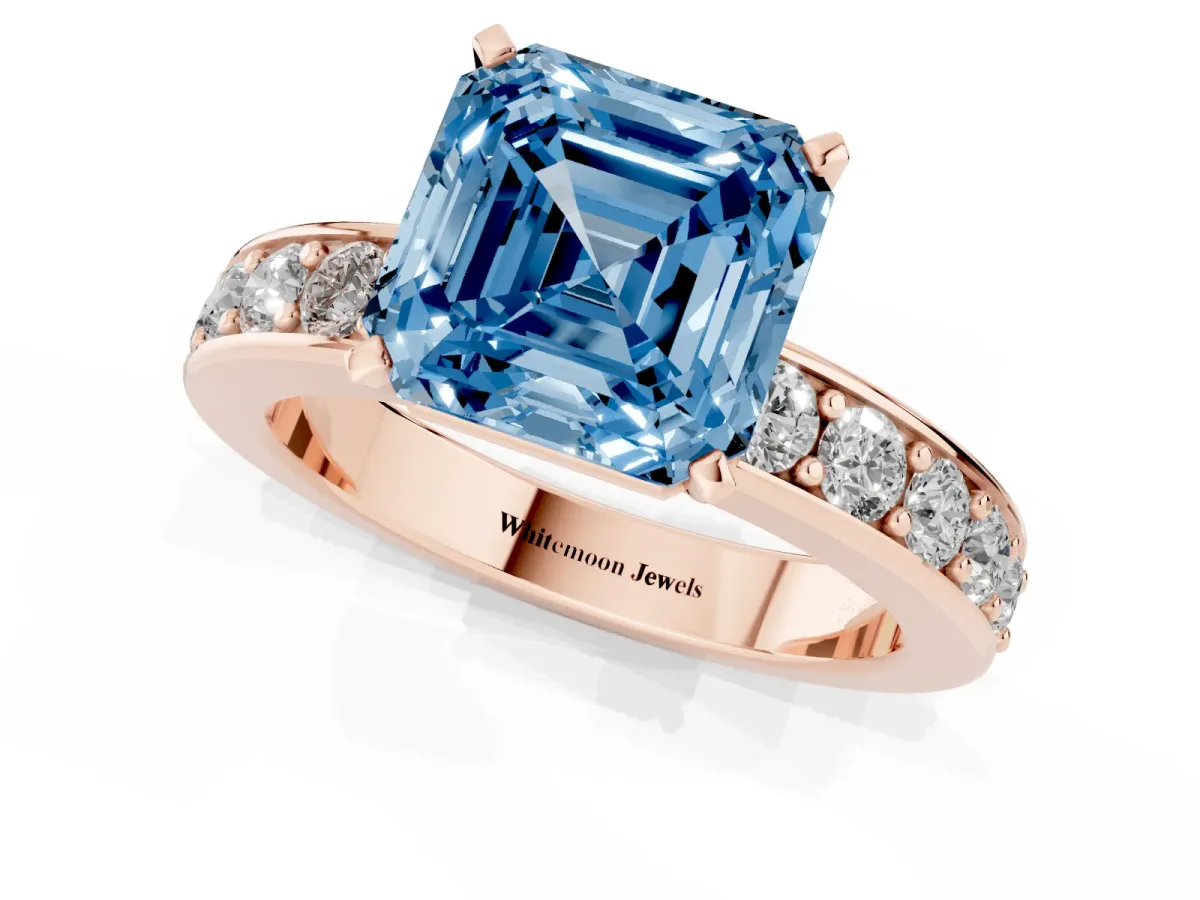 Fancy Blue Asscher Cut Diamond Engagement Ring with Channel Set Round Band and Prong Setting Rose gold