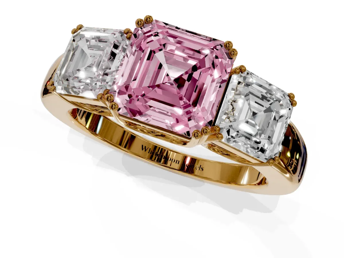 Fancy Pink Three-Stone Asscher Cut Cut Diamond Ring with Channel Set Band and Four-Prong Setting Yellow gold