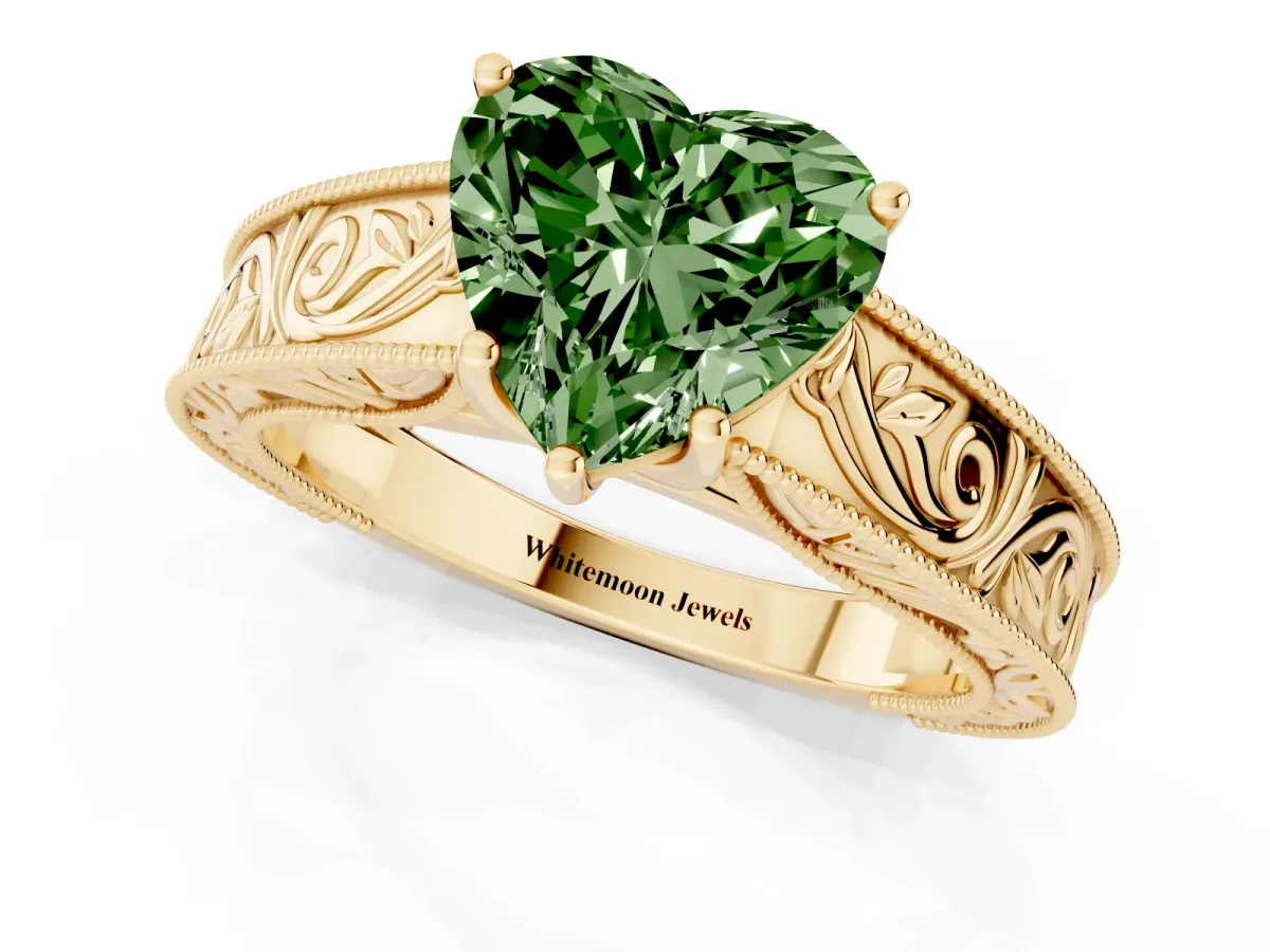 Fancy Green Heart Cut Diamond Solitaire Ring with Engraved Band and Four-Prong Setting Yellow gold