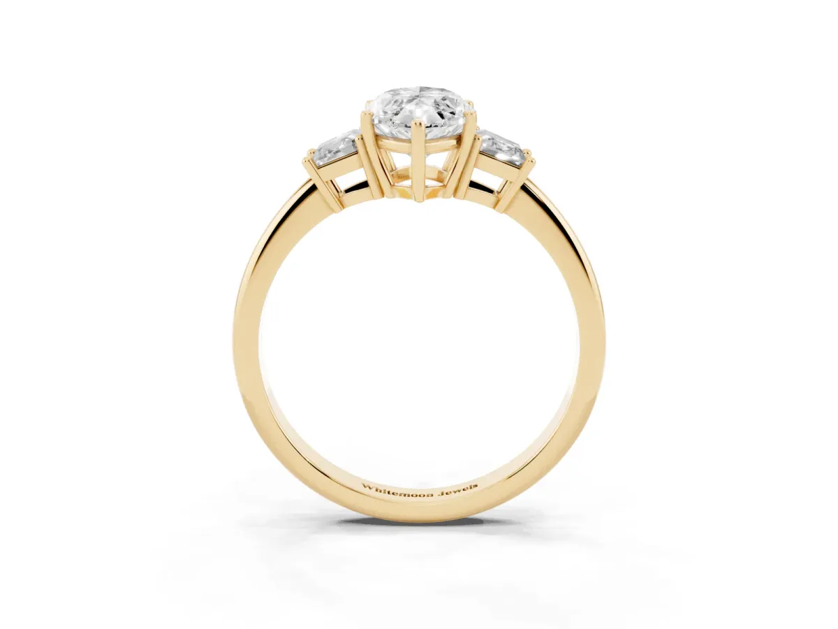 Marquise Cut Diamond Three-Stone Ring with Trapezoid Side Stones and Prong Setting Yellow gold