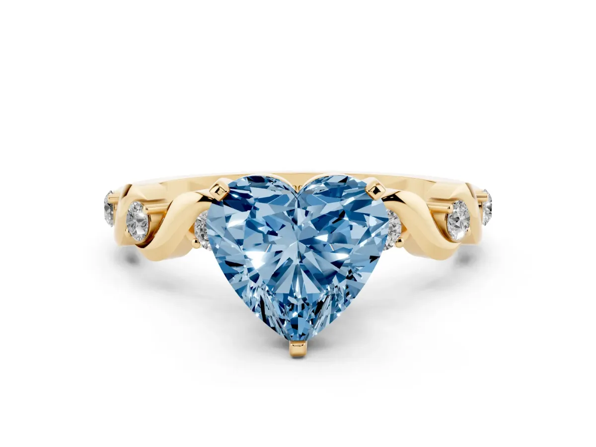 Fancy Blue Heart Cut Diamond Solitaire Twisted Band with Round Accents and Prong Setting Yellow gold